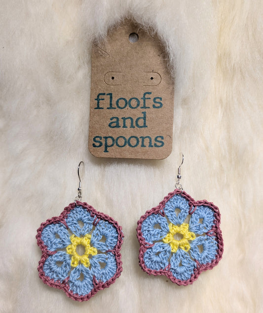 Yellow, light blue, dusty rose African violets (L)